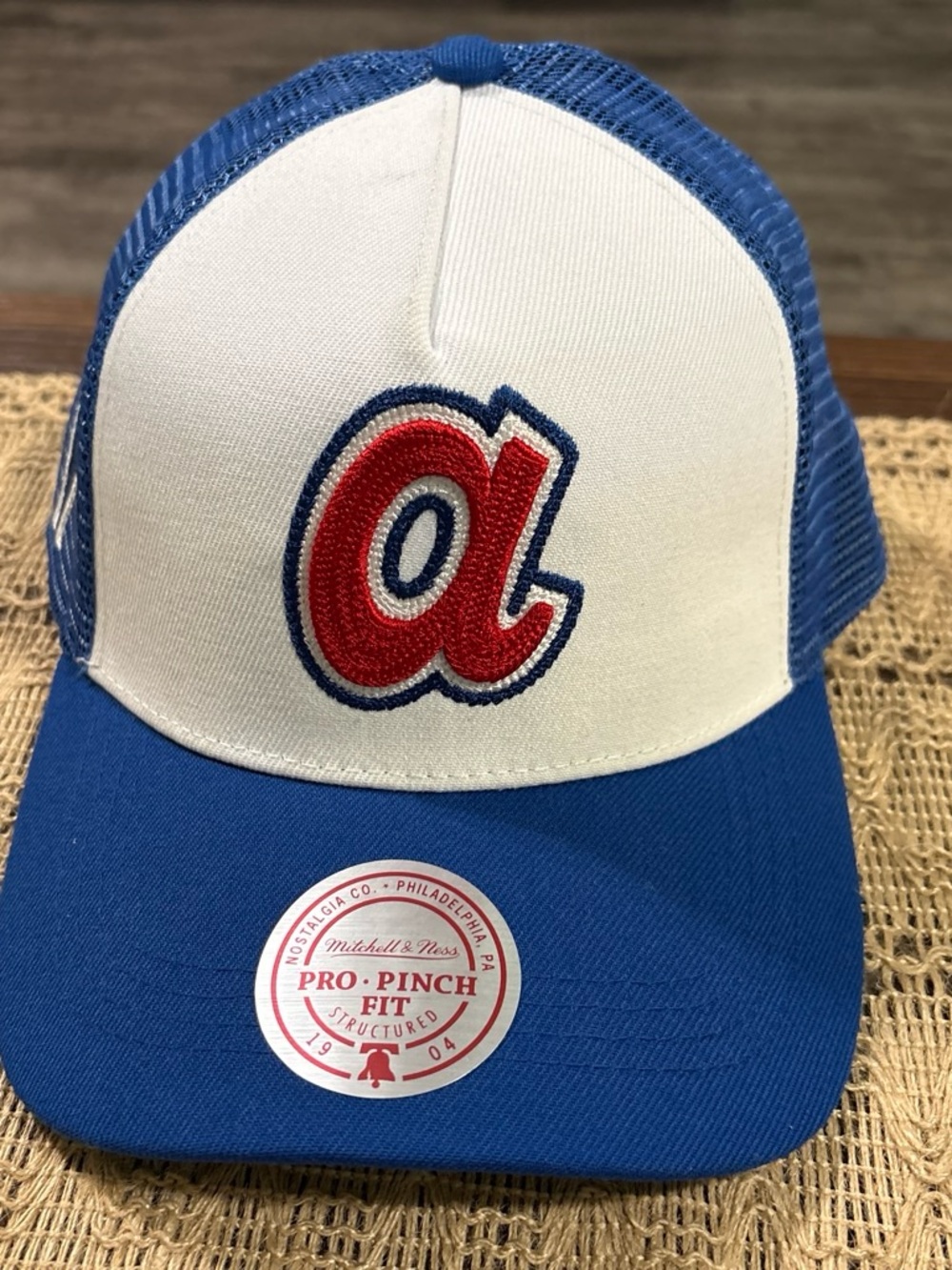 Mitchell & Ness White Front Blue Trucker Hat with Red 'a' Patch